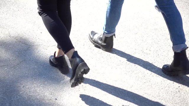 Young Couple Taking A Romantic Walk - Back View