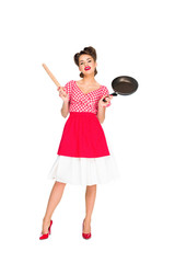 stylish woman in retro clothing with rolling pin and frying pan isolated on white