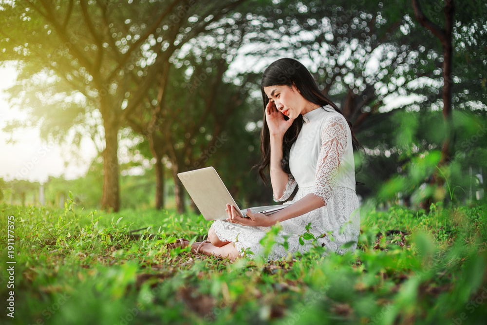 Sticker beautiful woman using laptop in the park