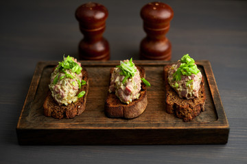 bruschetta, on slices of toasted baguette garnished with basil