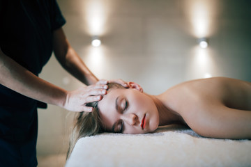 Rejuvenating relaxing massage by masseur