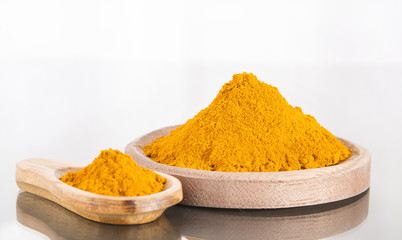Organic turmeric powder on white background