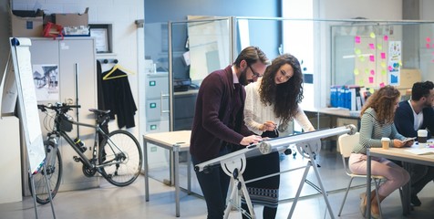 Executives working on drafting table