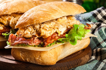 Ciabatta sandwich with smoked bacon and eggs