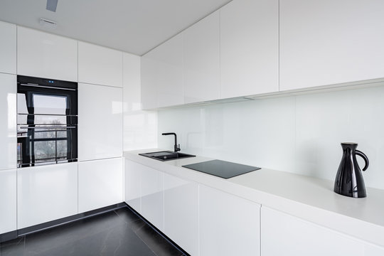 White kitchen with stone floor