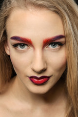 Fototapeta premium Young woman with dyed eyebrows, closeup