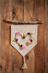 Pennant with a heart of paper flowers