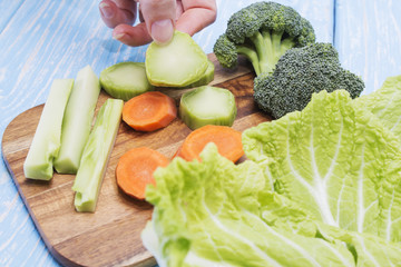 A set of fresh vegetables on a wooden table. The concept of a healthy diet