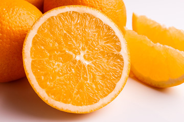 oranges and juice on a white background