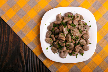 boiled broad beans on a rustic background