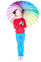 Portrait of cute Asian girl standing under open multicolored umbrella on white background