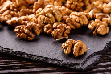 Walnut on a dark rustic wooden background