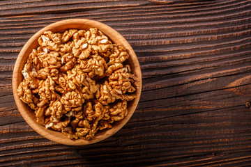 Walnut on a dark rustic wooden background