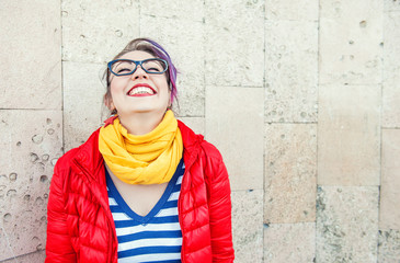 Happy beautiful fashion hipster woman laughing