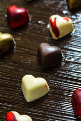 chocolate hearts on black background