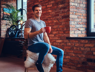 A handsome man with BMX in a studio.