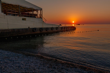 Fototapeta premium dawn on the shore of the Black Sea/ dawn on the beach of the village of Utes, Crimea