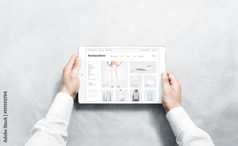 Sticker hands holding tablet with fashion webstore mock up on screen, isolated. clothing web page interface 