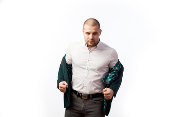 Bald man businessman in an unbuttoned white shirt, green suit tiredly looking and posing on white isolated background, front view