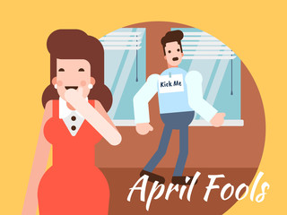 Woman laughing man with kick me sticker on back for april fools' day