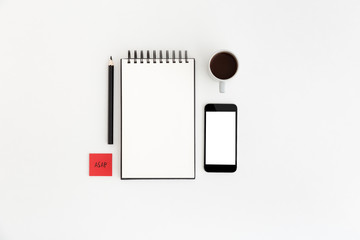 white desk, table with spiral notebook, pen and smartphone screen template. Flat lay.