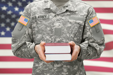 USA army collage recroit holding books in his hands