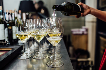 waiter brings glasses of champagne