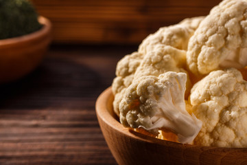 cauliflower and broccoli on a rustic background