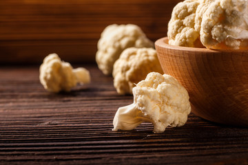 cauliflower and broccoli on a rustic background