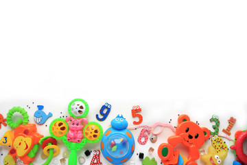 Fototapeta na wymiar Children's toys and accessorieson a White background.view from above