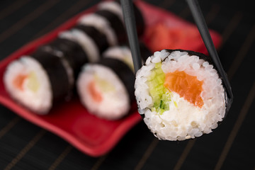 closeup photo of one sushi roll with salmon