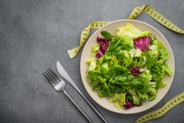 Diet concept background with measuring tape