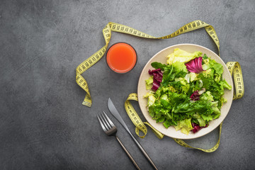 Diet concept background with measuring tape