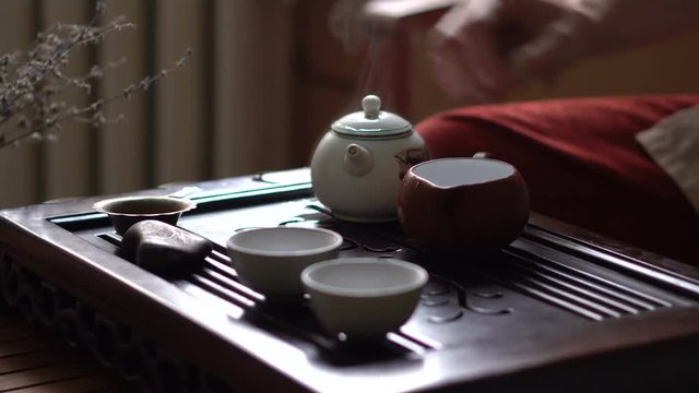 Pouring of Green Tea in Traditional Chinese Tea Ceremony. Set of Equipment for Drinking Tea