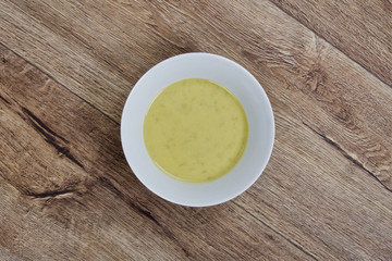 Pea soup on a wooden table