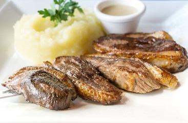 juicy steak beef meat with tomato and potatoes