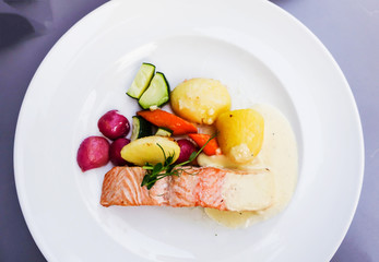 french cuisine dish with tomato and salmon