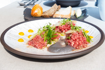 tasty Steak tartare (Raw beef) - classic steak tartare on white plate
