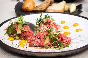 tasty Steak tartare (Raw beef) - classic steak tartare on white plate