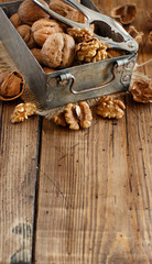 Fresh walnuts on an old wooden table