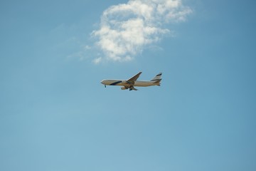 An airplane flying in the sky. 