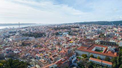 Panoramic view of Lisbon,Portugal town center form the of the many viewpoints parks.Architecture and culture in Europe.Tourist attraction.Beautiful view form the miradouro to the river and the bridge