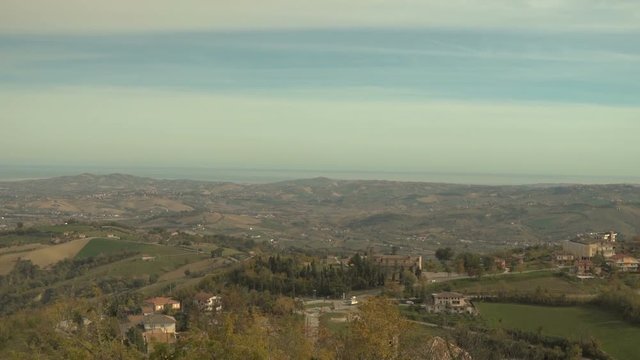 Beautiful landscape of hills and valleys in Abruzzo, sea in the distance.