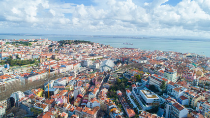 Naklejka premium Panoramic view of Lisbon,Portugal town center form the of the many viewpoints parks.Architecture and culture in Europe.Tourist attraction.Beautiful view form the miradouro to the river and the bridge