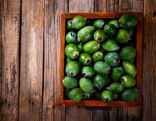 Feijoa Fruits. Fresh ripe sweet .Tropical fruit. Background of green color.Food or Healthy diet concept.Super Food.Vegetarian.Top View.Copy space for Text.selective focus.