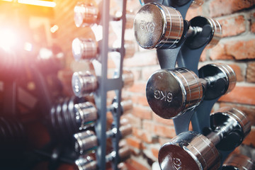 Stand with dumbbells of small scales, chrome, reflective and shiny coating