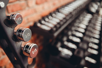Obraz na płótnie Canvas Dumbbell. Stand Rows of dumbbells in gym with loft modern gym