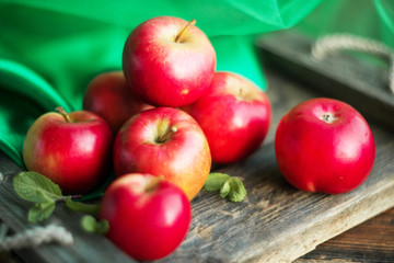 group of red apples on wooden natural background, fresh natural food and vitamins concept in rustic style