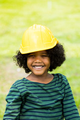 cute little African American boys  in a helmet, building and architectural concept