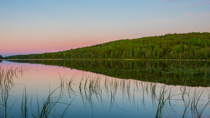 Pink sky with reflection in lake